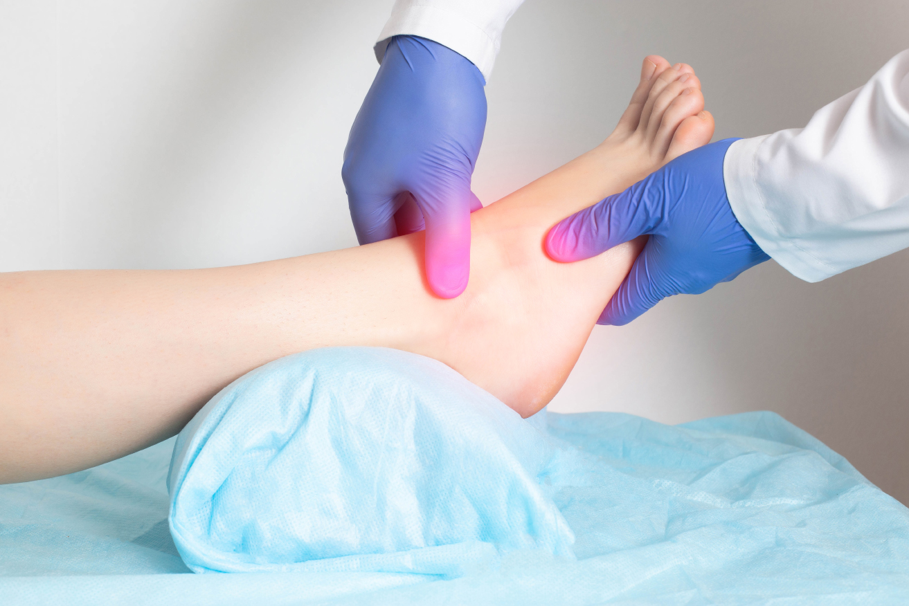 Doctor examining patient with gout in the ankle