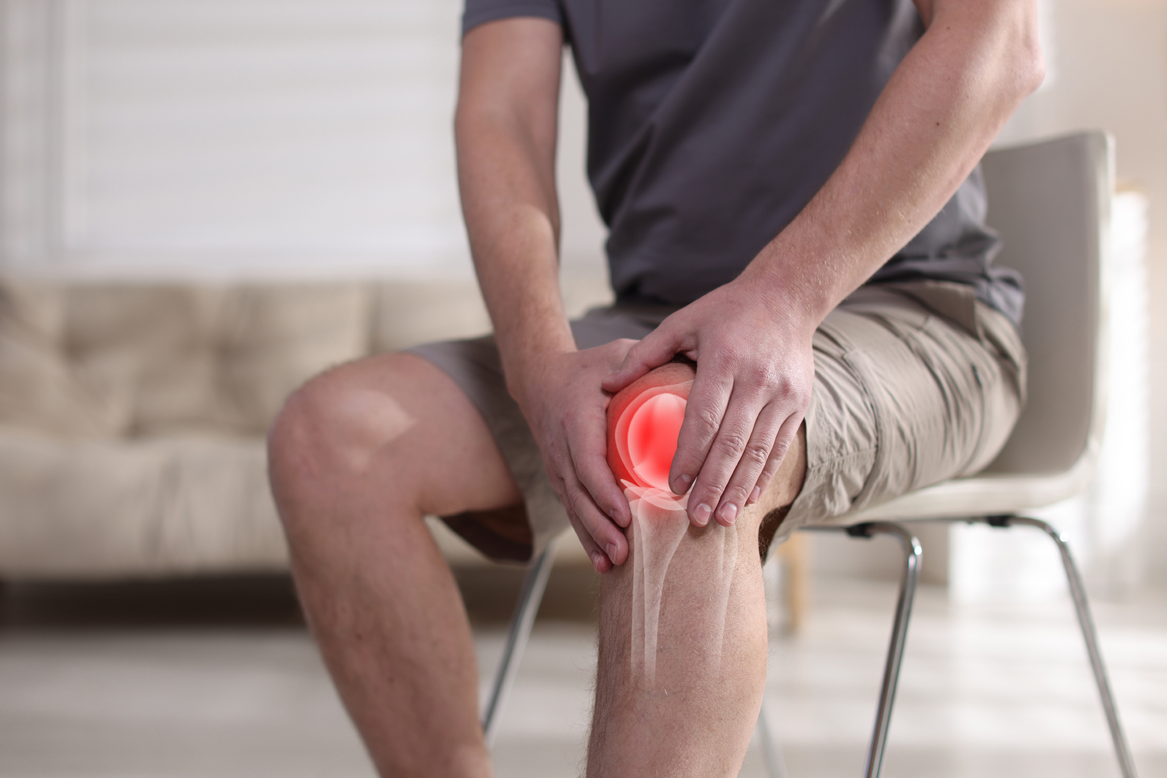 Man holding his knee due to joint pain