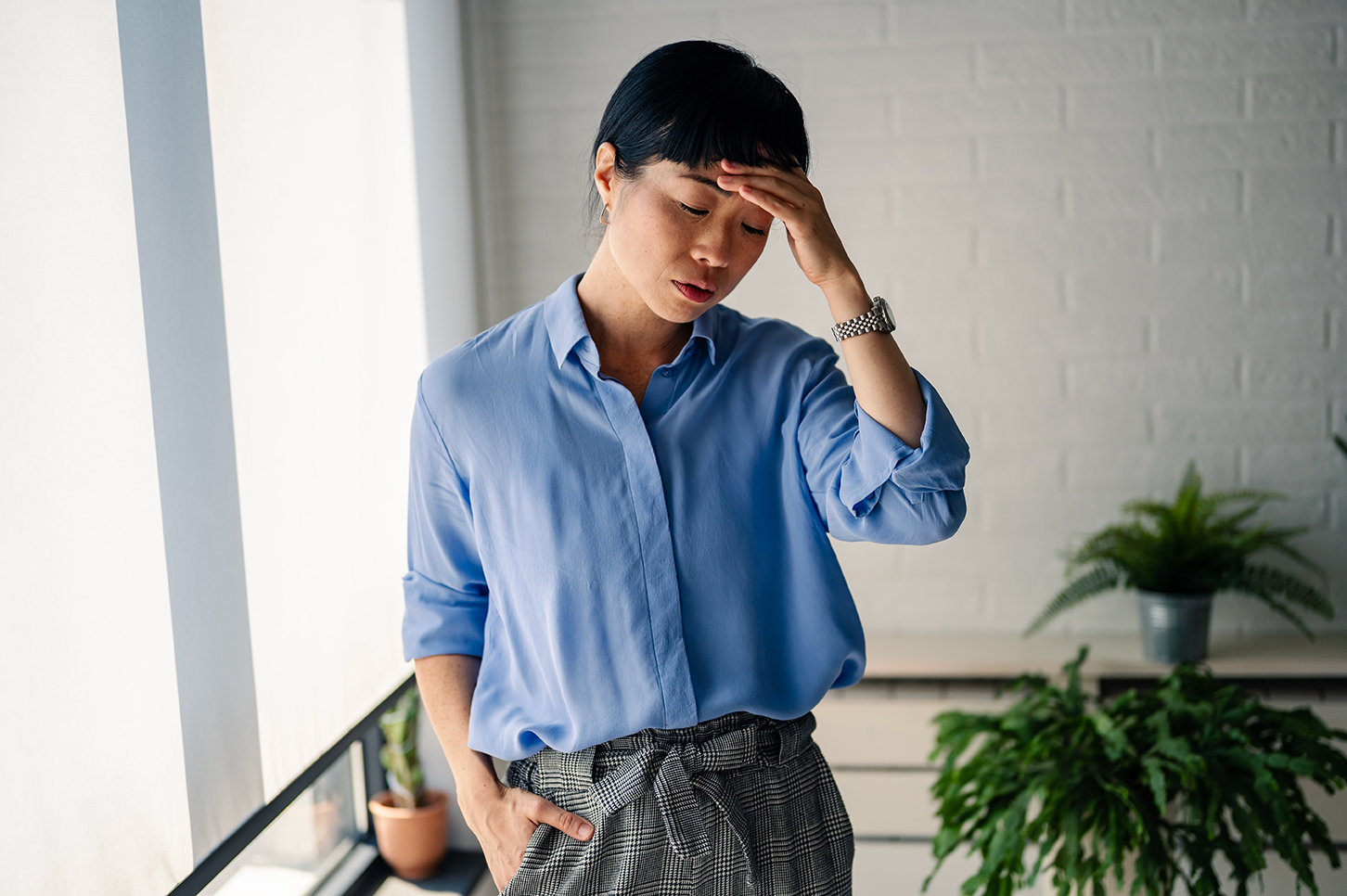 Woman appearing fatigued and low in energy.